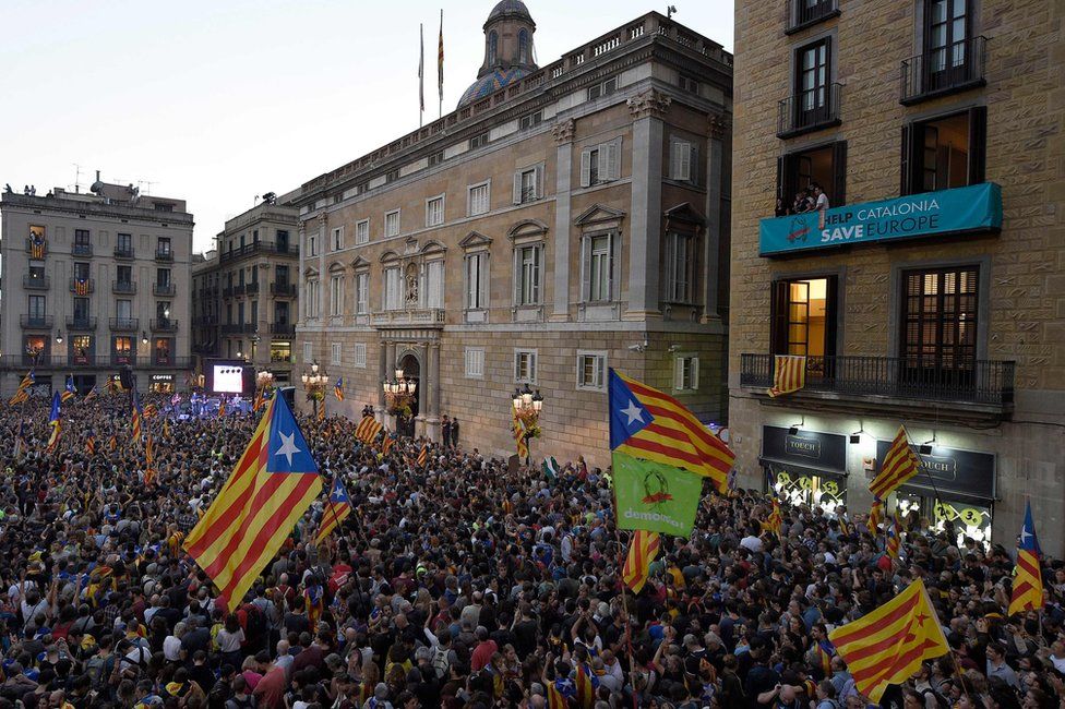 People gather to celebrate the proclamation of a Catalan republic on Sant Jaume Square in Barcelona, 27 October