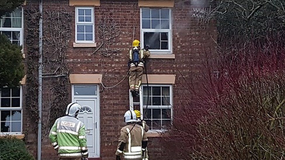 Firefighters at the house on Withington Lane