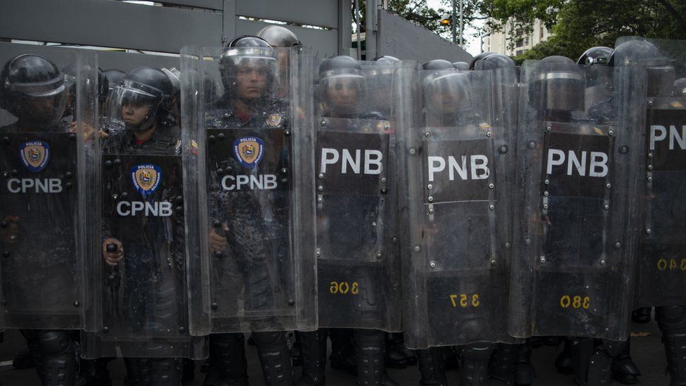 A large group of Venezuelan National Police officers block a street during a demonstration against the government of Nicolas Maduro organized by supporters of Juan Guaido on March 10, 2020 in Caracas, Venezuela
