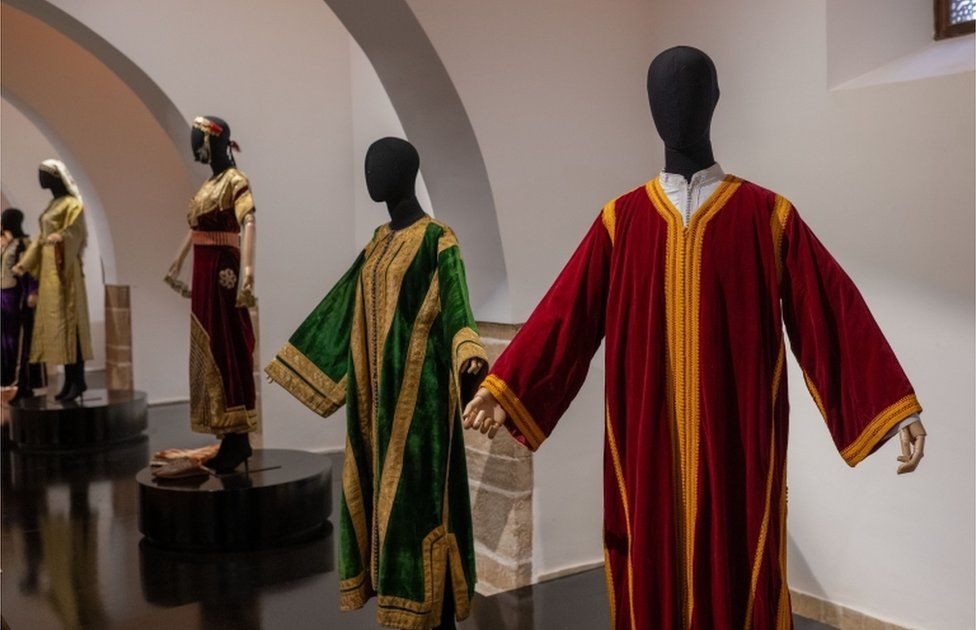 Caftans on display during the exhibition.