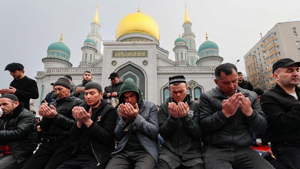 Worshippers praying outside Central Sobornaya Mosque, Moscow Russia