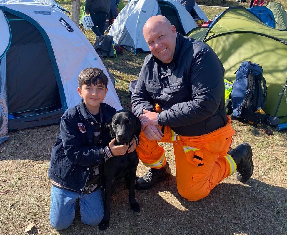 The K9 Search & Rescue NI team making new friends at the camp