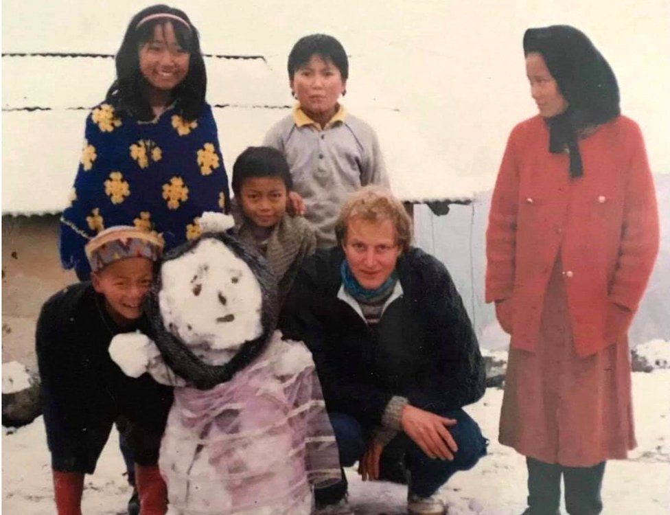 Reka (wearing headband) with her family when she was growing up in the in the Himalaya foothills