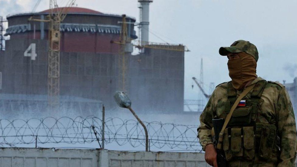 A Russian soldier guards Zaporizhzhia nuclear plant