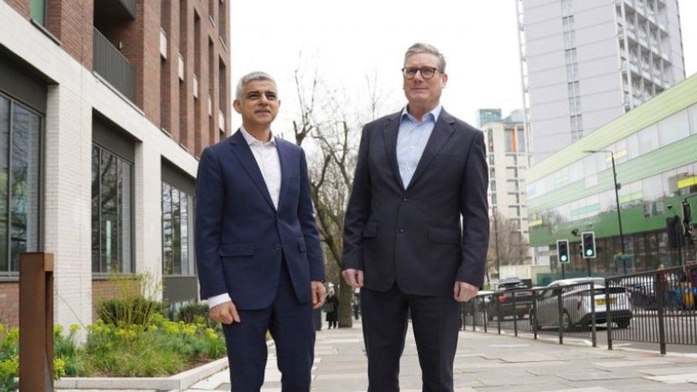 Sadiq Khan walks in front of Sir Keir Starmer as they enter Mr Khan's launch event in Westminster