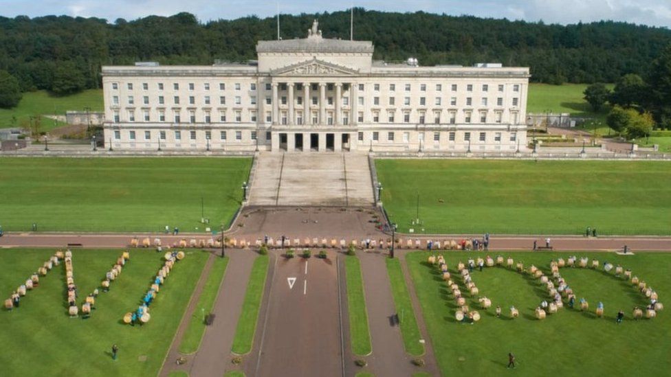 People gather outside Stormont with Lambeg drums