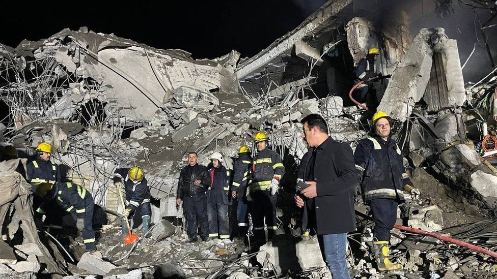 First responders search through the rubble of a damaged building in Irbil, northern Iraq, following overnight Iranian ballistic missile strikes (16 January 2024)