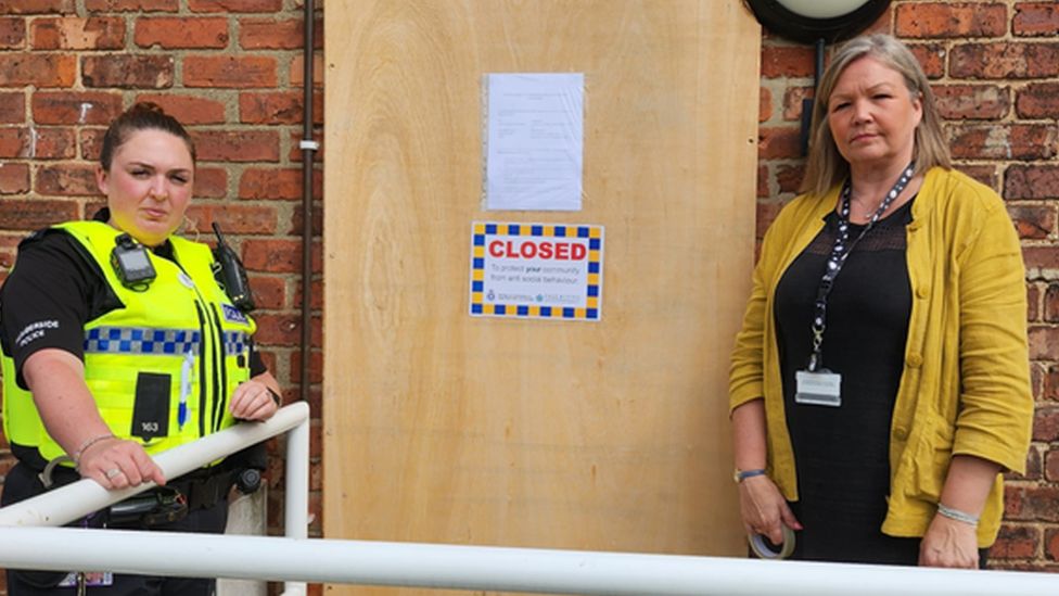 Police and council officials outside flat