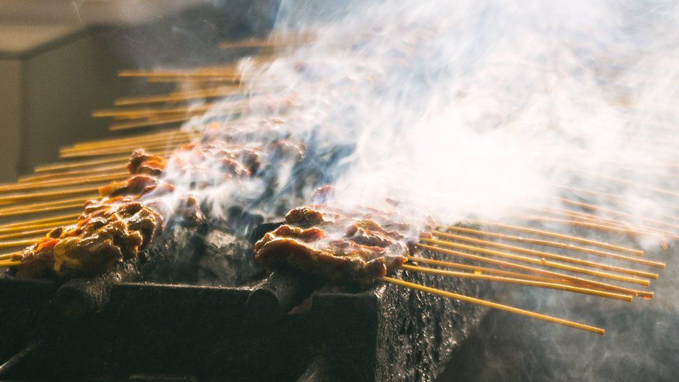 Meat being grilled on skewers