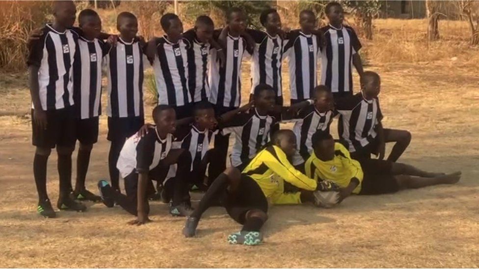The Mfuwe team in their NUFC strips and football boots