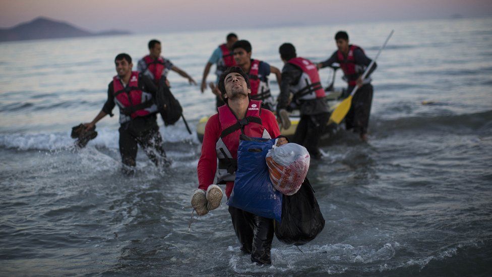 Migrants from Pakistan come ashore on the Greek island of Kos, 31 Aug 15