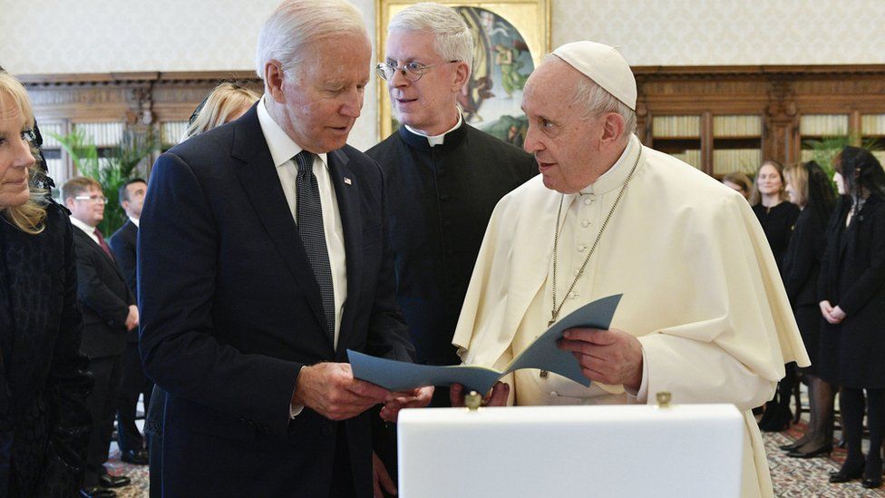 A handout picture provided by the Vatican Media Press Office shows Pope Francis giving audience to US President Joe Biden accompanied by his wife, Jill Biden and entourage, at the Vatican City, 29 October 2021