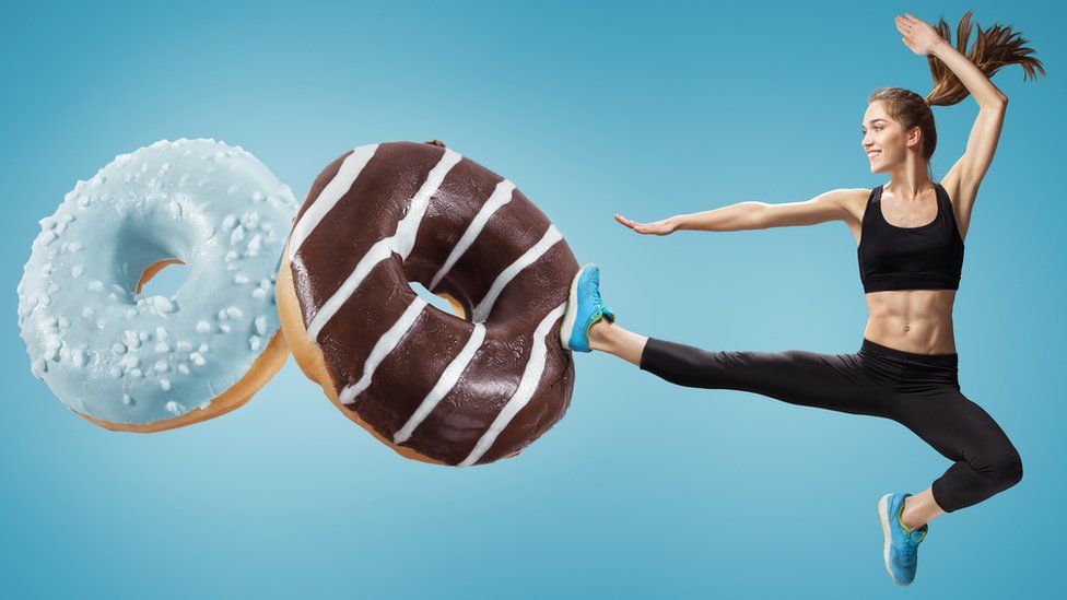 Woman kicking doughnuts