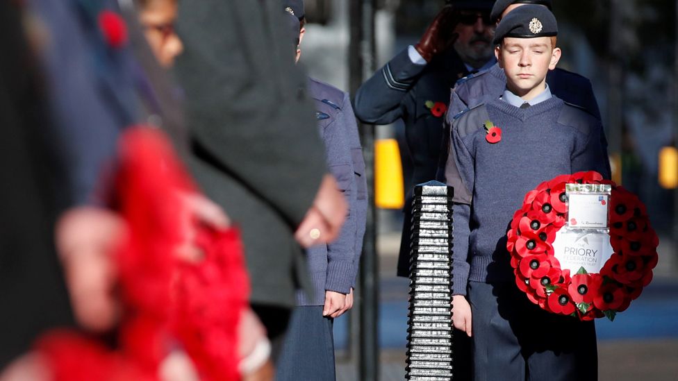Cadet with poppy wreath at the Cenotaph on 11 November 2021