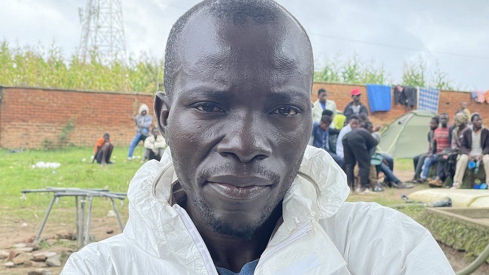 Man in a white protective suit