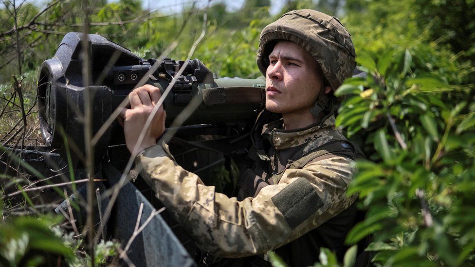 A Ukrainian soldier holds an anti-tank weapon