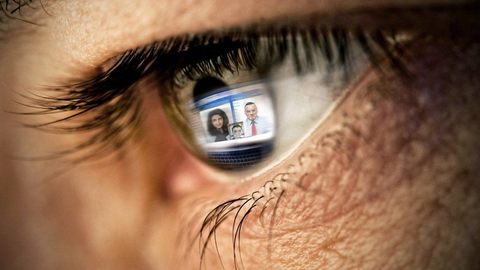 Stock image of a video call reflected in a persons eye