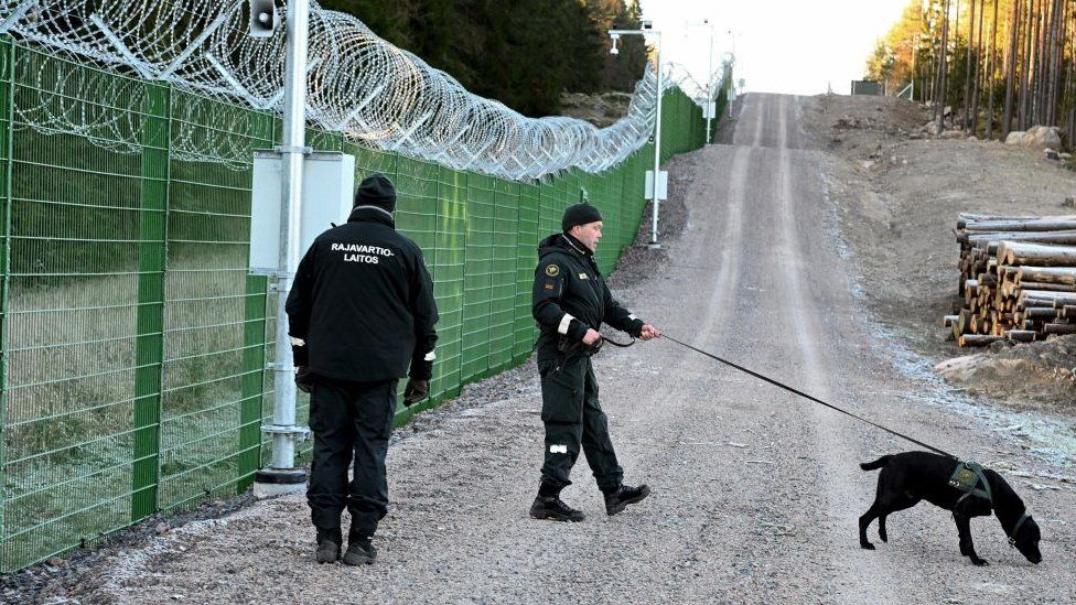 Finnish border guards patrol the frontier with Russia