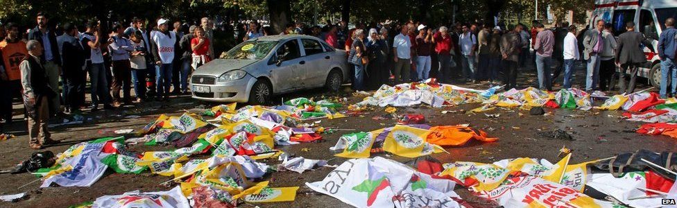 Victims' bodies covered in banners after multiple explosions before a rally in Ankara, Turkey 10 October 2015.