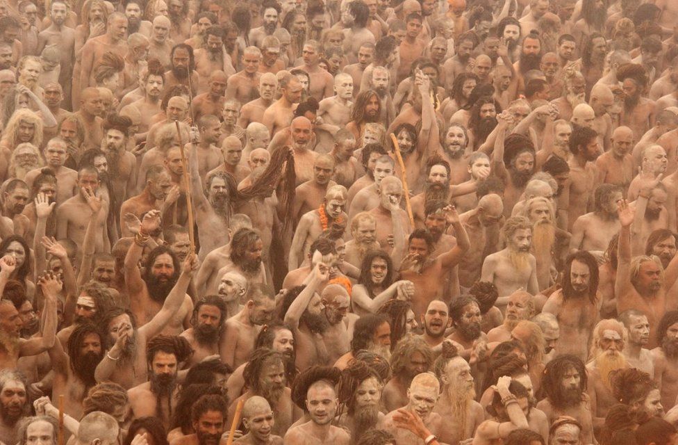 Sadhus going to take a dip in the Ganges