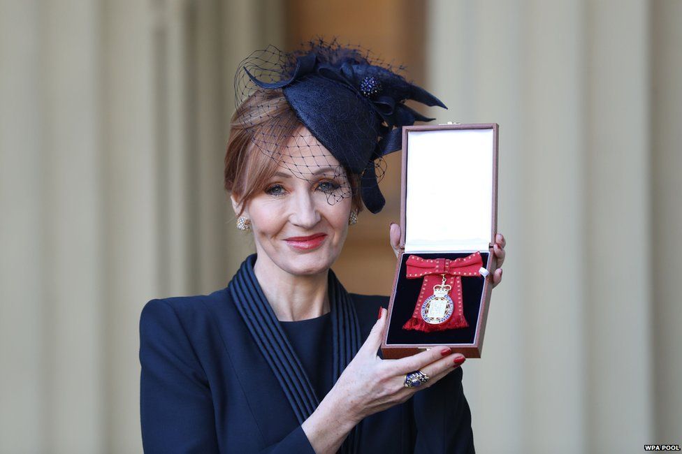 J. K. Rowling posing with her Companion of Honour medal, which she won this week.