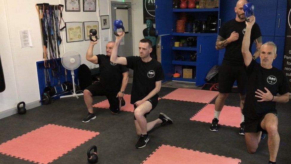 gary and his clients using kettlebells