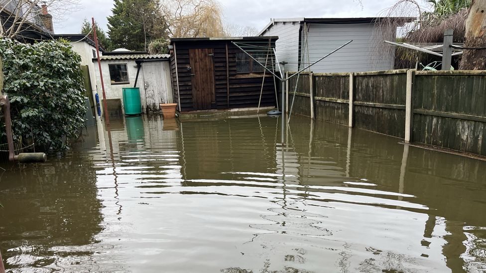 Flooded outbuildings in Chertsey