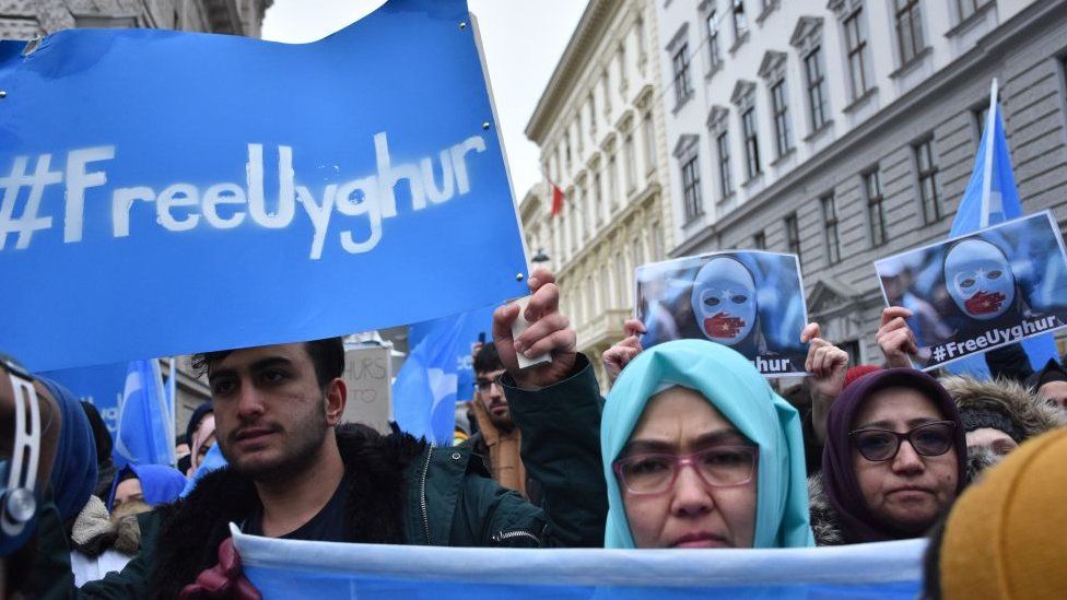 People take part in a demonstration against Chinas persecution of Uighurs in Xinjiang, in Vienna