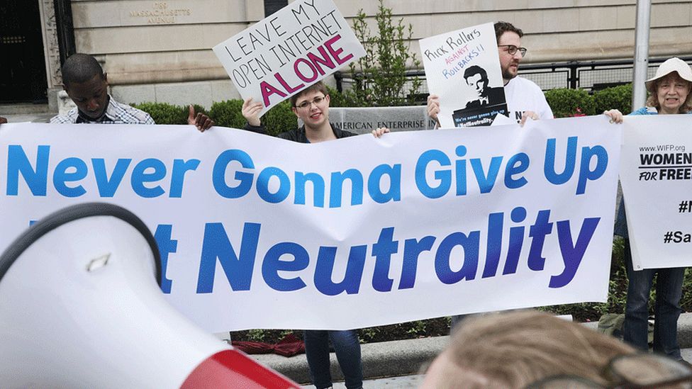 Protesters in Washington, with pro-net neutrality banners