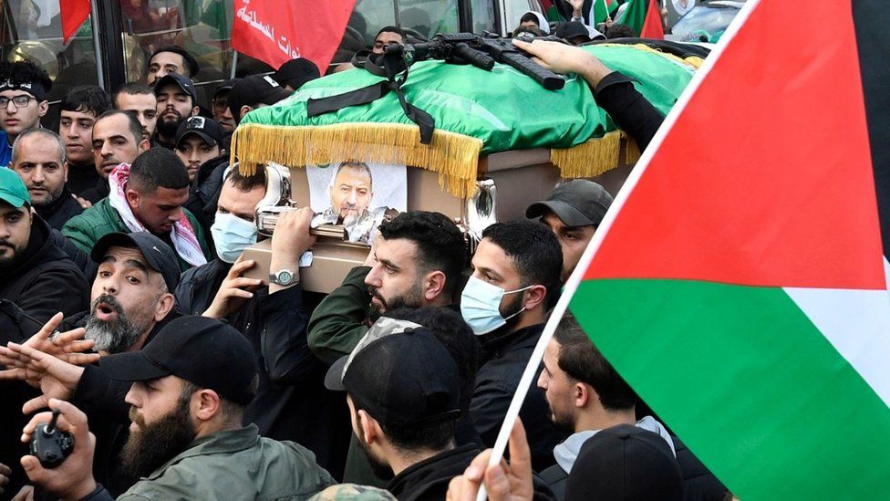 Mourners carry the coffin of Hamas deputy leader Saleh al-Arouri, and the others killed in a drone attack, during his funeral in Beirut