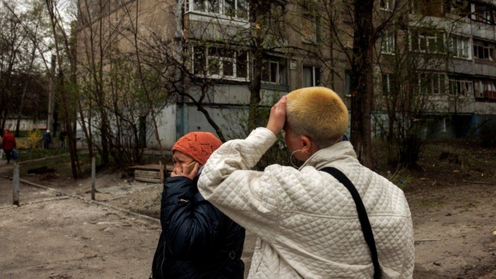 Image shows woman crying on phone