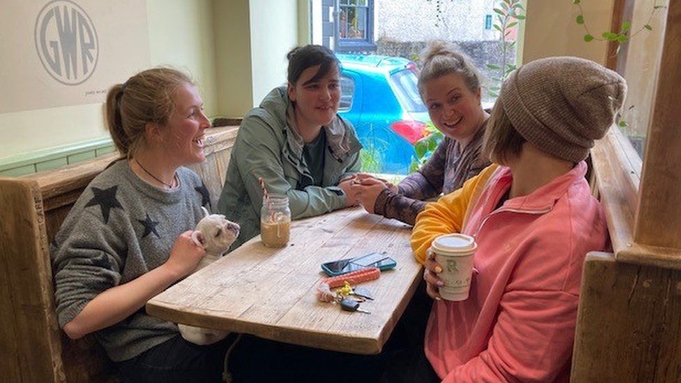 four women in coffee shop