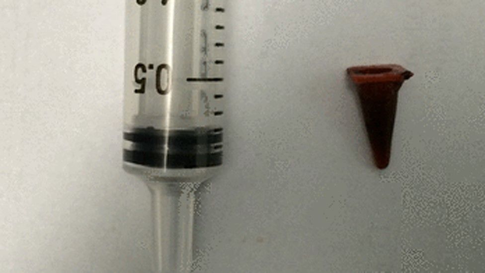 syringe and toy cone