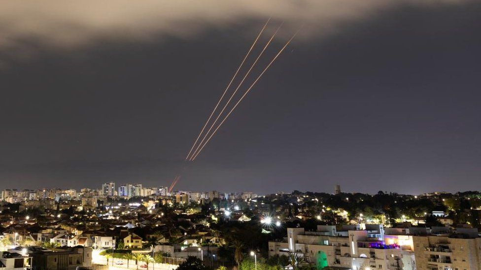 An anti-missile system operates over Israel following an Iranian attack on the country