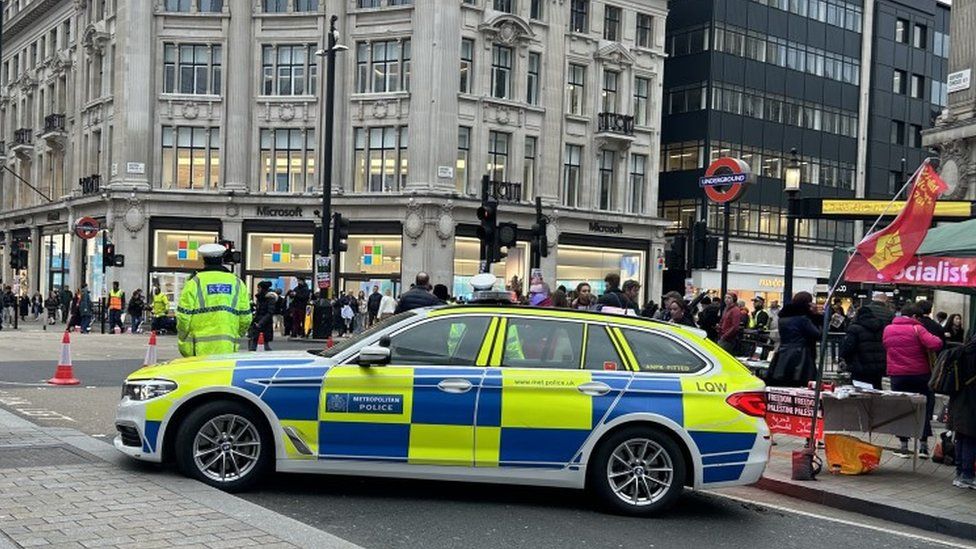 Police cars blocked the roads as the march took place in Oxford Circus, London