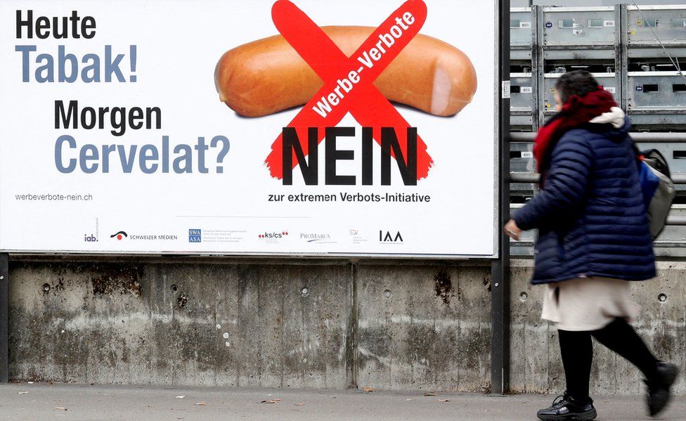 No-campaign posters have sprung up warning: "Today tobacco, tomorrow sausages?"