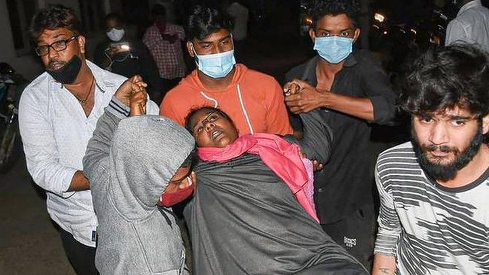 A woman being rushed to hospital.