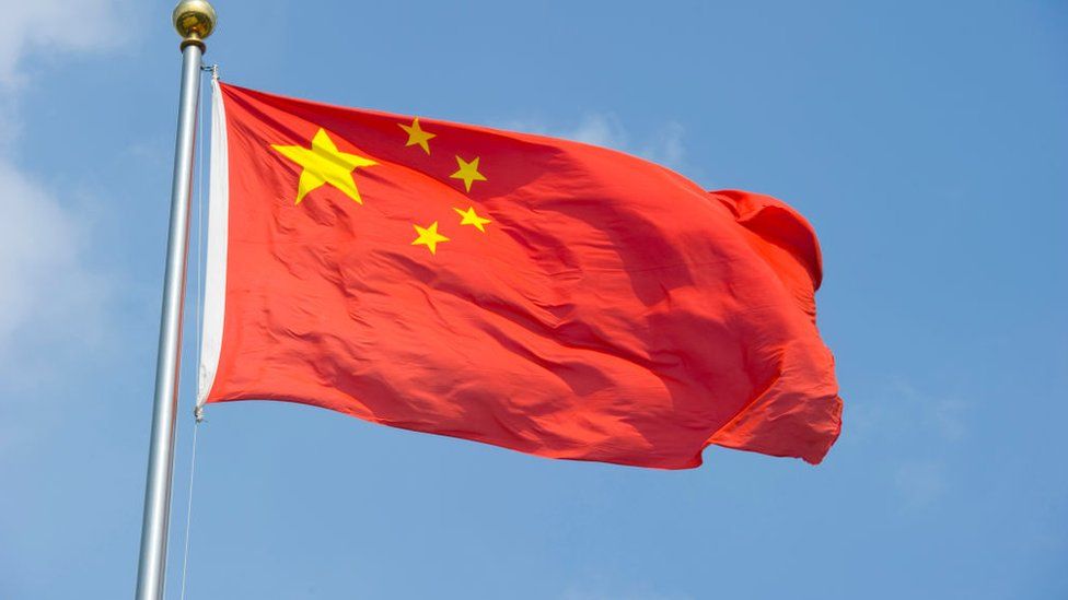The Chinese flag flaps in the wind on August 5, 2010 in Shanghai, China.