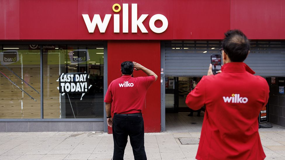 Workers outside Wilko store
