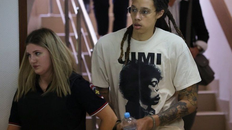 Handcuffed US basketball player Brittney Griner (right) arrives in a court building in Khimki, outside Moscow. Photo: 1 July 2022