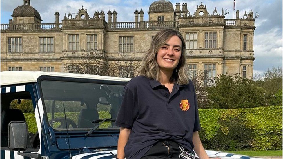 Kayleigh Smith sitting on a Landrover outside Longleat House