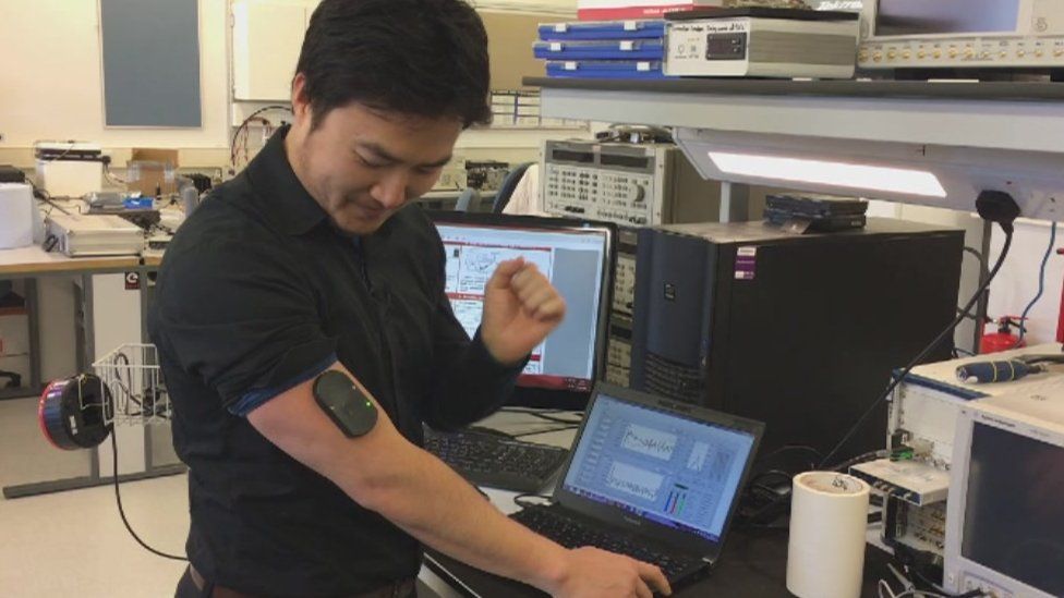 Cardiff University's Dr Heungjae Choi demonstrates how the device can be worn