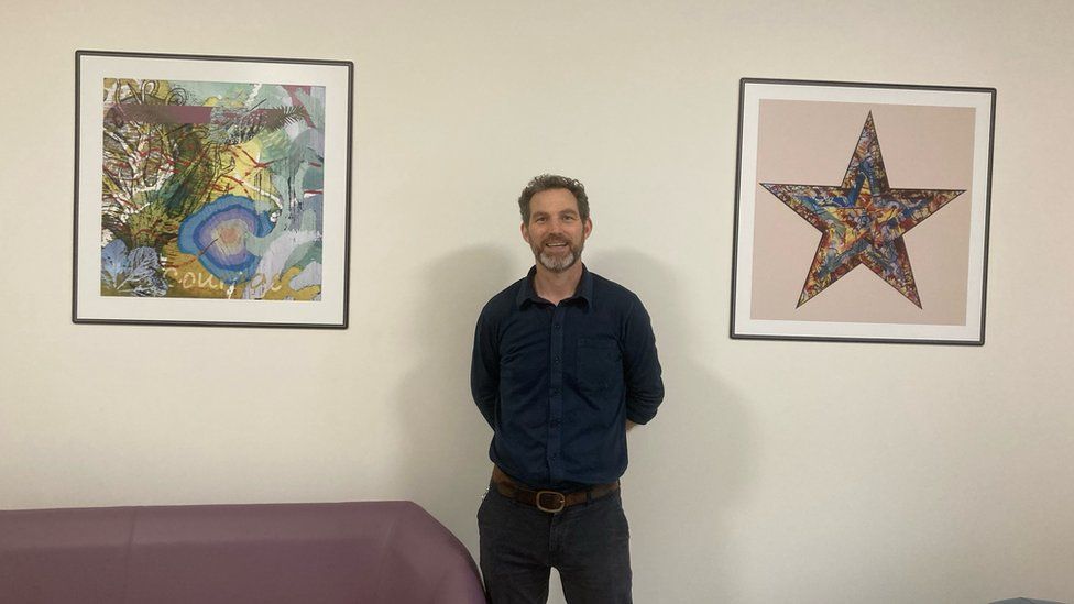 Project Manager Tom Cox with some of the artwork