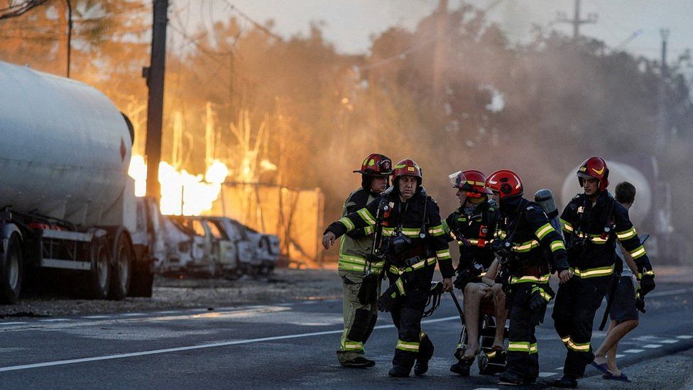 Firefighters at scene of blasts in Crevedia, Romania, 26 Aug 23