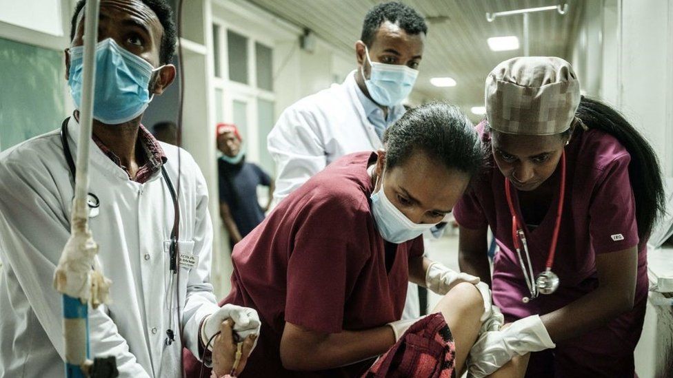 Medical staff give medical care to a young injured resident of Togoga, a village about 20km west of Mekele, at the Ayder referral hospital in Mekele, the capital of Tigray region, Ethiopia, on June 23, 2021