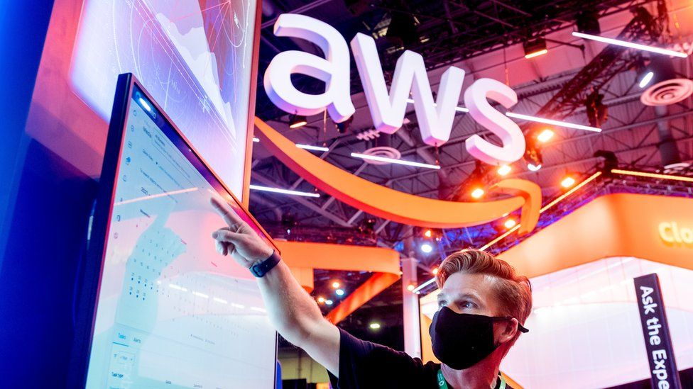 An attendee demonstrates software during AWS re:Invent 2021, a conference hosted by Amazon Web Services