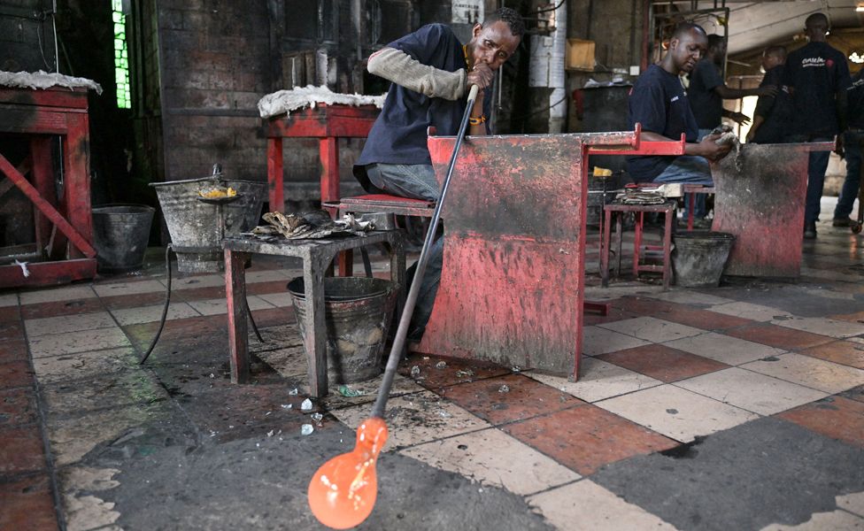 A man blowing recycled glass in Kajiado, Kenya - Friday 6 October 2023