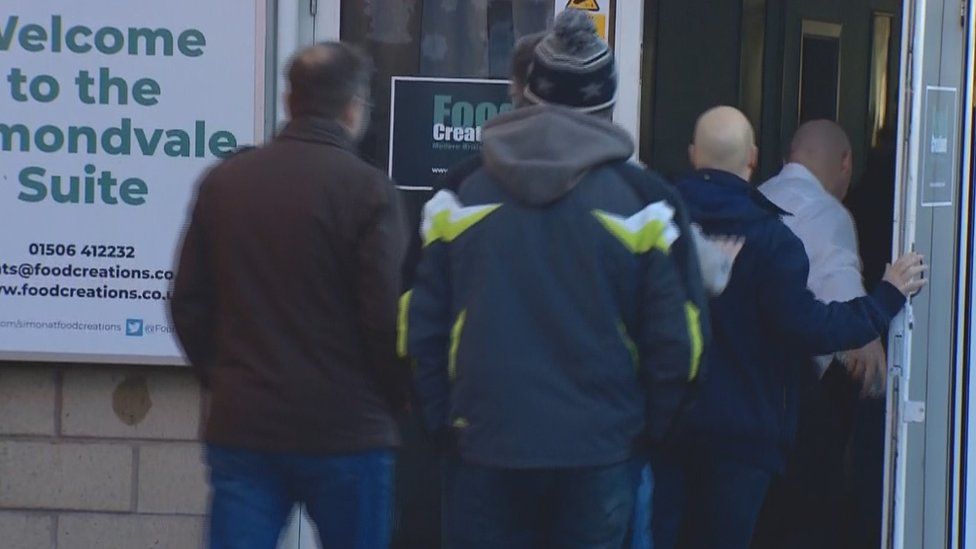 Workers arriving for crisis meeting