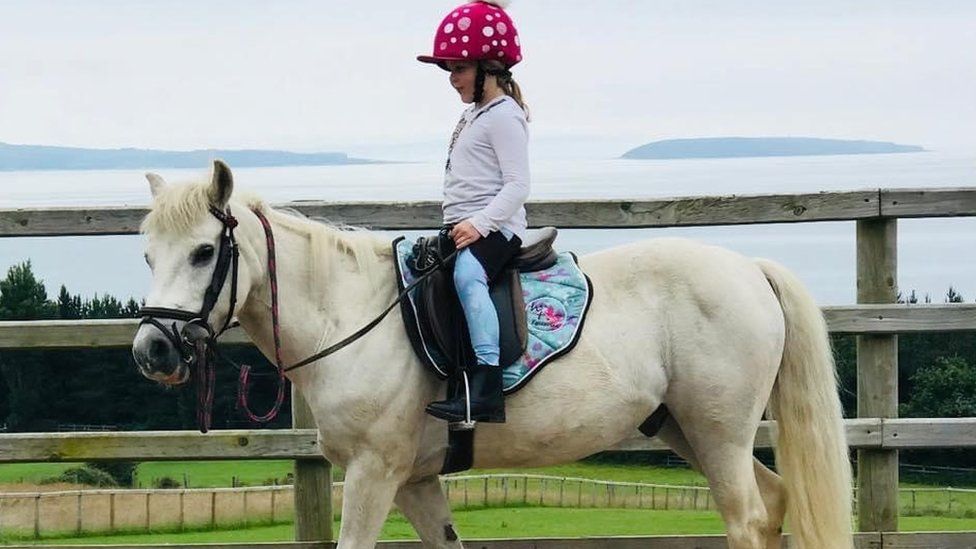 Ivy Roberts riding a pony