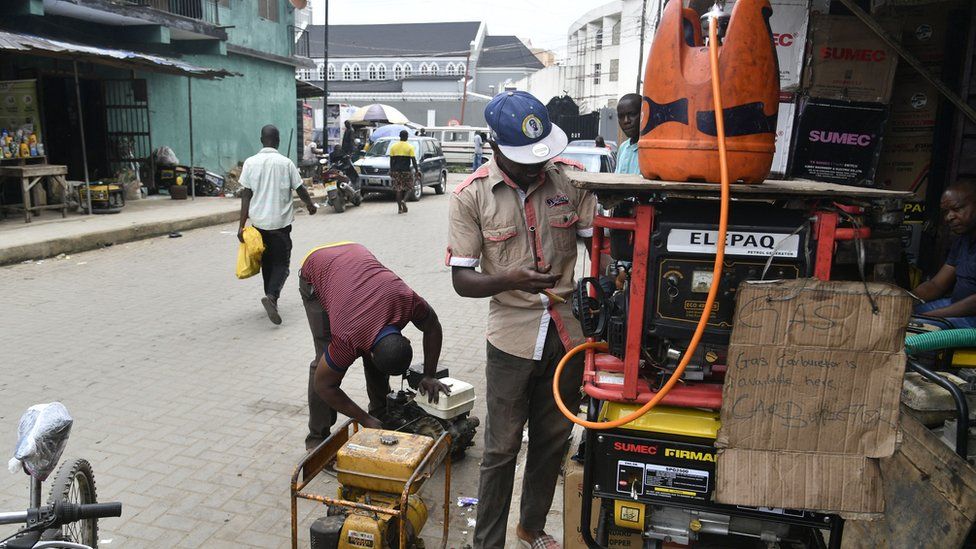 Roadside engineers try to convert fuel powered generators to gas, to sustain their operations at Ebute Metta in Lagos, on July 25, 2023.